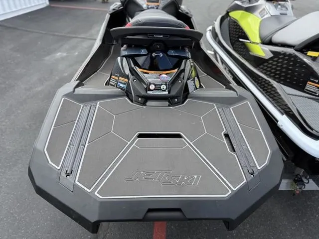 Slide: The Image of 2026 Kawasaki Ultra 160 Jet Ski on a parking lot. - 24