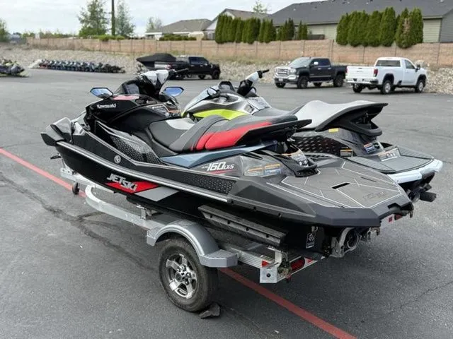 Slide: The Image of 2026 Kawasaki Ultra 160 Jetski on trailer outdoors. - 4