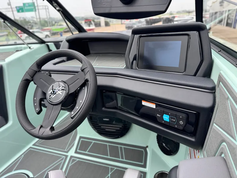 Slide: The Image of Interior of 2026 ATX Surf Boats 22 Type-S with steering wheel and display. - 17