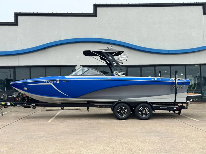 The Image of 2018 Tigé R23 boat in blue parked outside a building. - 1