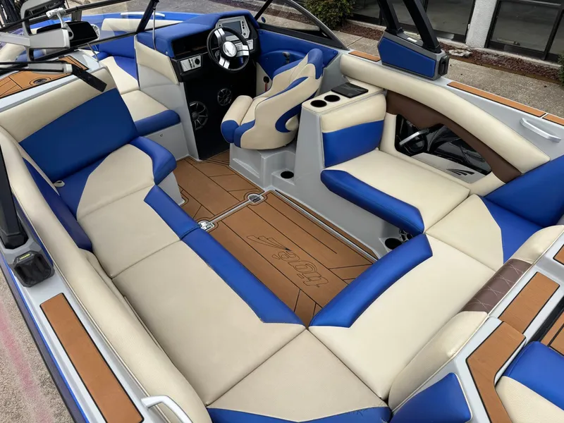 Slide: The Image of Interior of a 2018 Tigé R23 boat with blue and beige seating. - 10