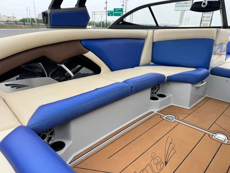 Slide: The Image of Interior of a 2018 Tigé R23 boat with blue and beige seating. - 11