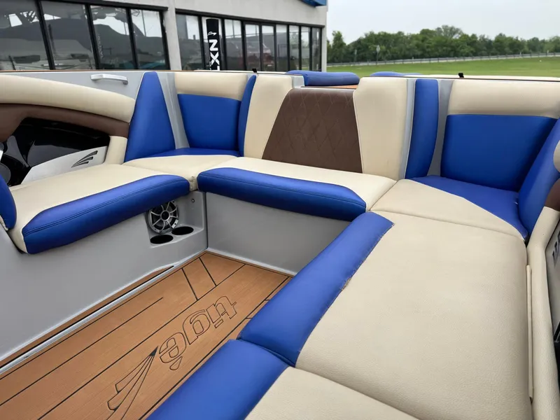 Slide: The Image of Interior of a 2018 Tigé R23 boat with blue and beige seating. - 12