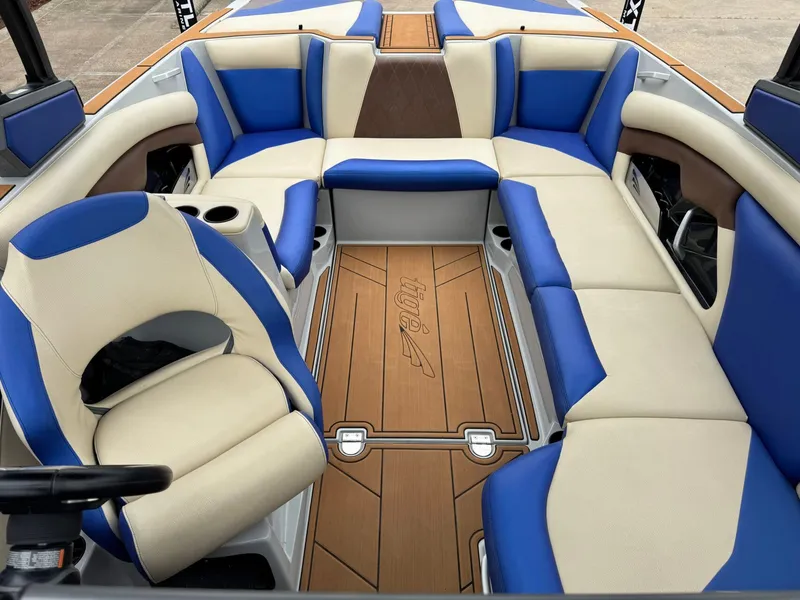 Slide: The Image of Interior of a 2018 Tigé R23 boat with blue and beige seating. - 16
