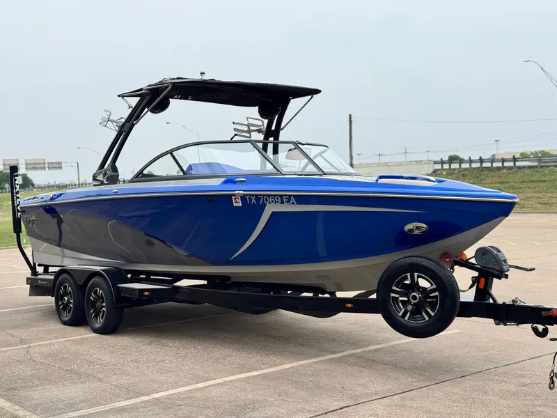 Slide: The Image of 2018 Tigé R23 boat on trailer, blue and black. - 6