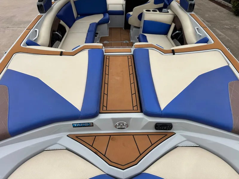 Slide: The Image of Interior of a 2018 Tigé R23 boat with blue and beige seating. - 7
