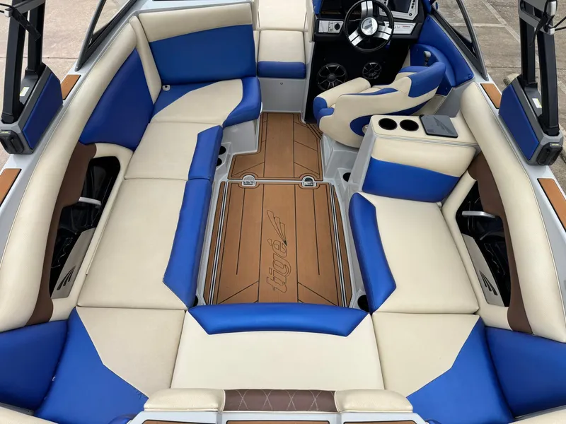 Slide: The Image of Interior of a 2018 Tigé R23 boat with blue and beige seating. - 8
