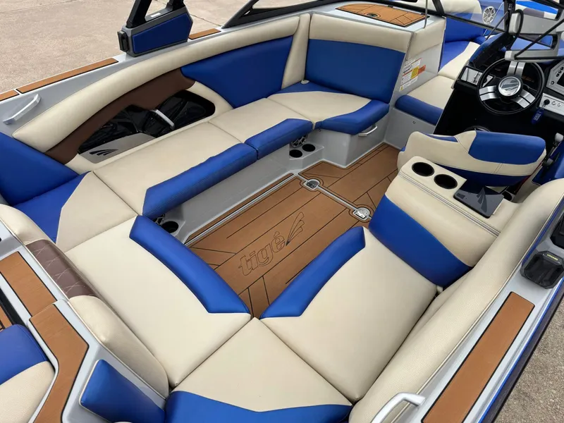 Slide: The Image of Interior of a 2018 Tigé R23 boat with blue and beige seating. - 9