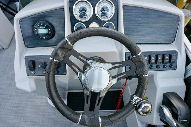 Slide: The Image of Steering console of 2020 Sylvan Mirage 8522 Cruise pontoon boat with gauges and controls. - 10