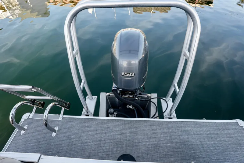 Slide: The Image of 2020 Sylvan Mirage 8522 Cruise pontoon boat with Yamaha 150 engine on calm water. - 13
