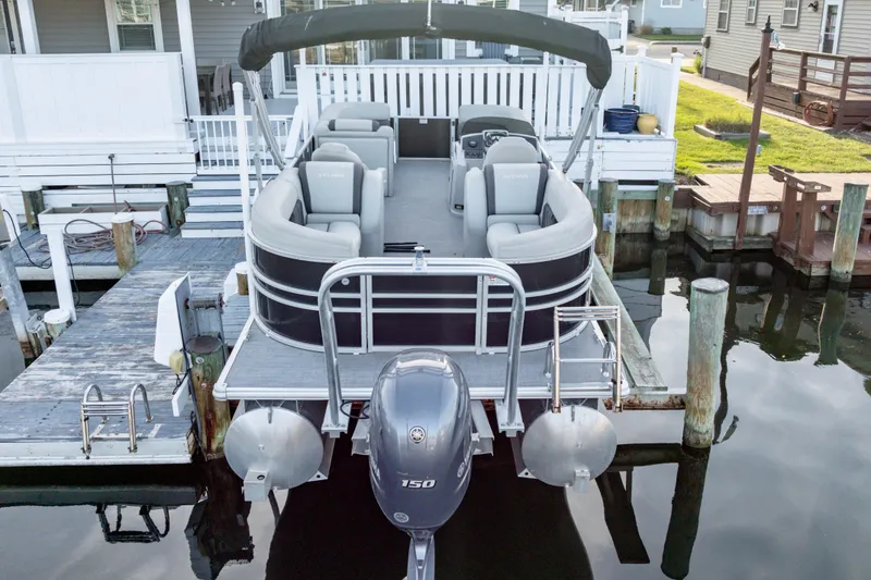 Slide: The Image of 2020 Sylvan Mirage 8522 Cruise pontoon boat docked at a marina. - 3