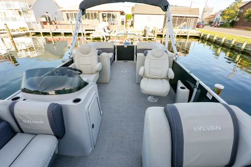 Slide: The Image of 2020 Sylvan Mirage 8522 Cruise pontoon boat with luxurious seating and waterfront view. - 5