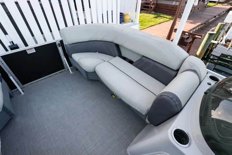 Slide: The Image of 2020 Sylvan Mirage 8522 Cruise boat interior with gray seating and carpeted flooring. - 6