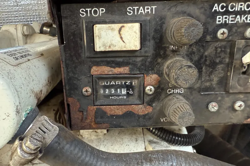 Slide: The Image of Control panel of a 2005 Sea Ray 290 Amberjack boat with hour meter reading 2318. - 17
