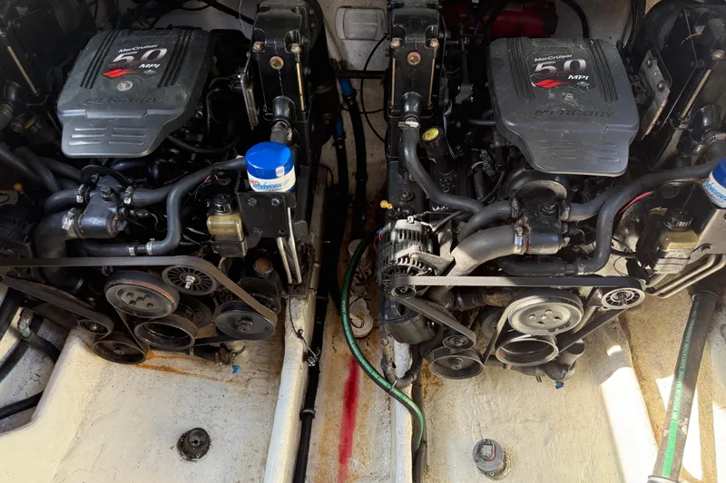 Slide: The Image of Twin MerCruiser engines in a 2005 Sea Ray 290 Amberjack boat. - 19