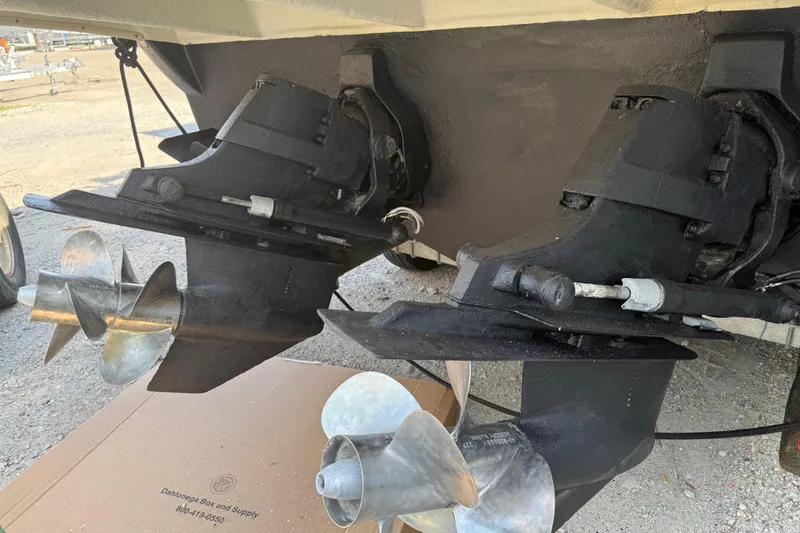 Slide: The Image of 2005 Sea Ray 290 Amberjack boat propellers and outdrives on a trailer. - 20