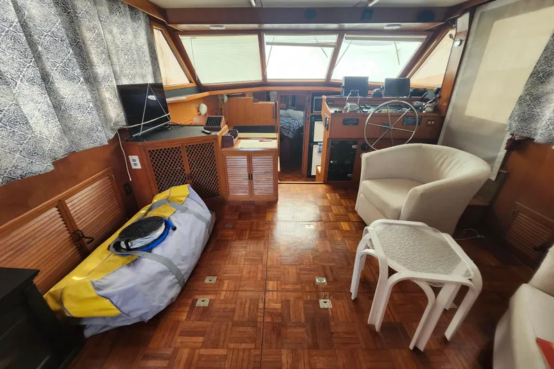 Slide: The Image of Interior of 1988 Marine Trader 43 yacht with helm, seating, and nautical equipment. - 3