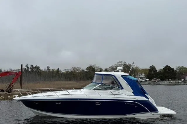 Slide: The Image of 2006 Formula 40 Performance Cruiser on a calm waterway, overcast sky. - 11