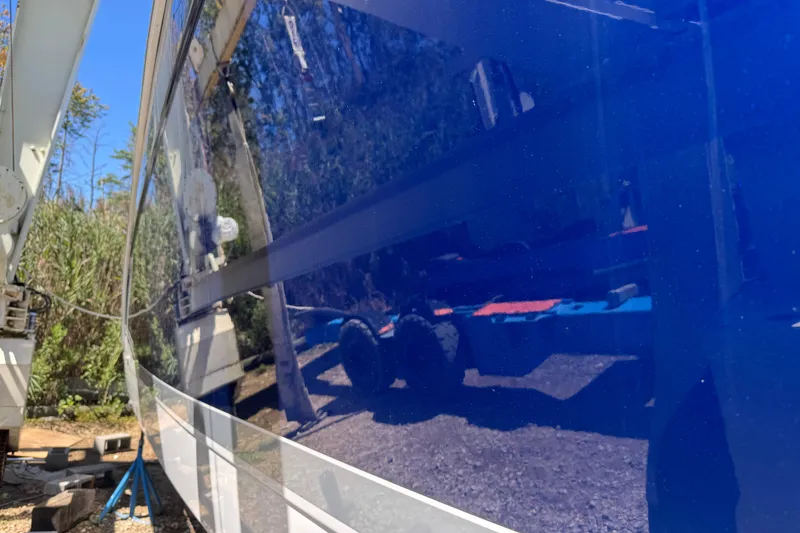 Slide: The Image of 2006 Formula 40 Performance Cruiser with glossy blue hull in dry dock. - 16