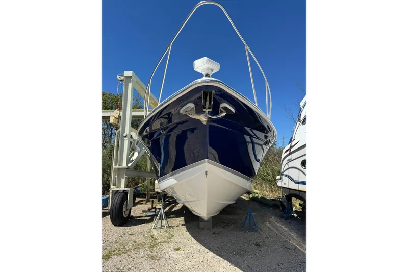 Slide: The Image of 2006 Formula 40 Performance Cruiser on dry dock under clear blue sky. - 18