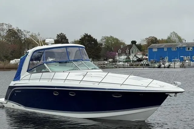 Slide: The Image of 2006 Formula 40 Performance Cruiser in a serene marina setting. - 3