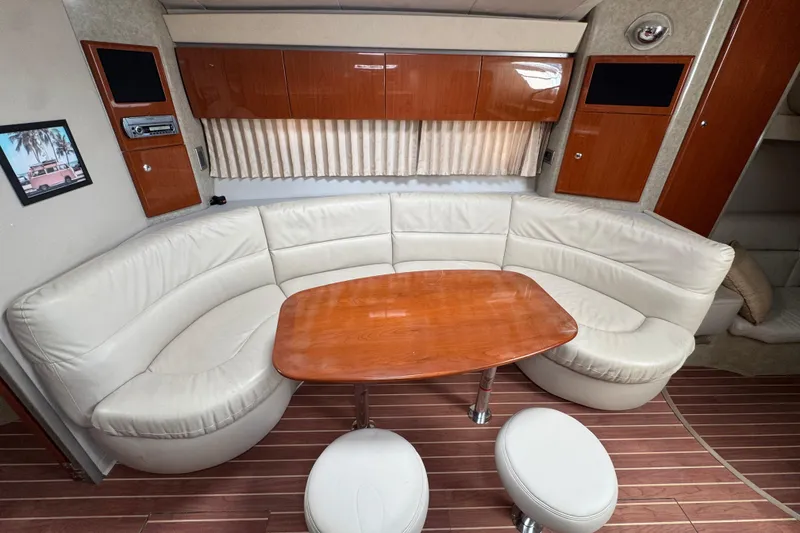 Slide: The Image of Interior of 2006 Formula 40 Performance Cruiser with leather seating and wooden table. - 36