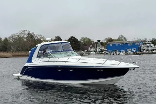 Slide: The Image of 2006 Formula 40 Performance Cruiser on calm water near marina. - 4