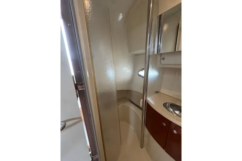 Slide: The Image of 2006 Formula 40 Performance Cruiser bathroom with shower, sink, and mirror. - 42