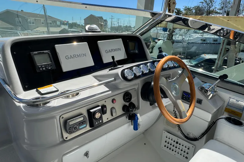 Slide: The Image of 2006 Formula 40 Performance Cruiser helm with Garmin navigation and wooden steering wheel. - 47