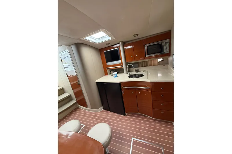Slide: The Image of Interior of 2006 Formula 40 Performance Cruiser with modern kitchen and wood cabinetry. - 58