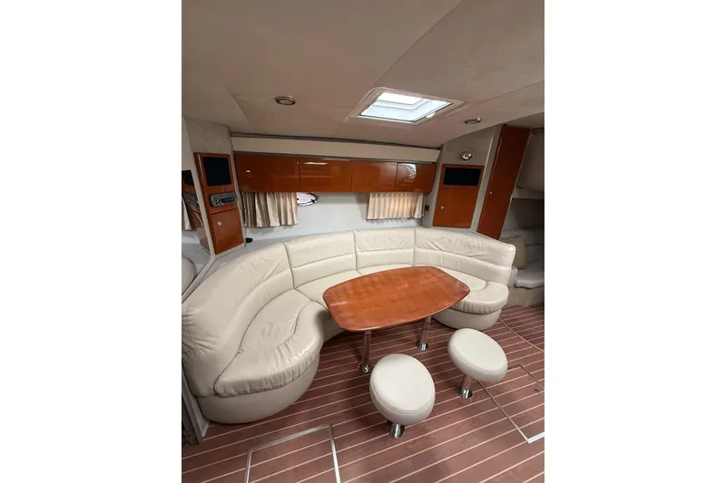 Slide: The Image of Interior of 2006 Formula 40 Performance Cruiser with curved seating and wooden table. - 59