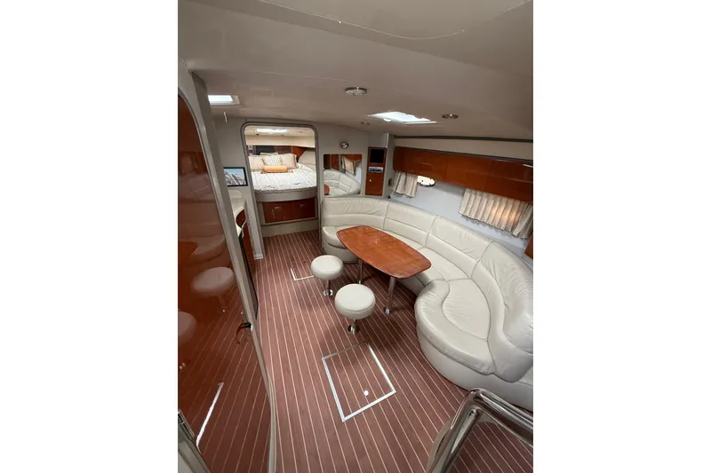 Slide: The Image of Luxurious interior of a 2006 Formula 40 Performance Cruiser with elegant seating and wood accents. - 60