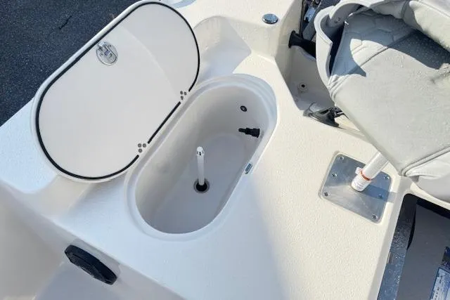 Slide: The Image of 2026 Carolina Skiff 192 JLS boat interior with open storage compartment and seating. - 15