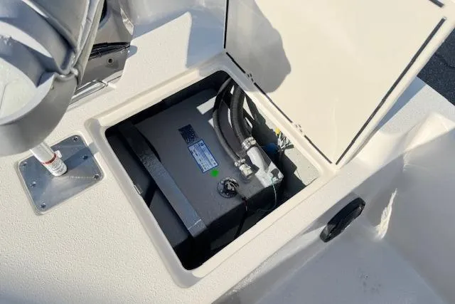 Slide: The Image of Open storage compartment on 2026 Carolina Skiff 192 JLS boat deck. - 16