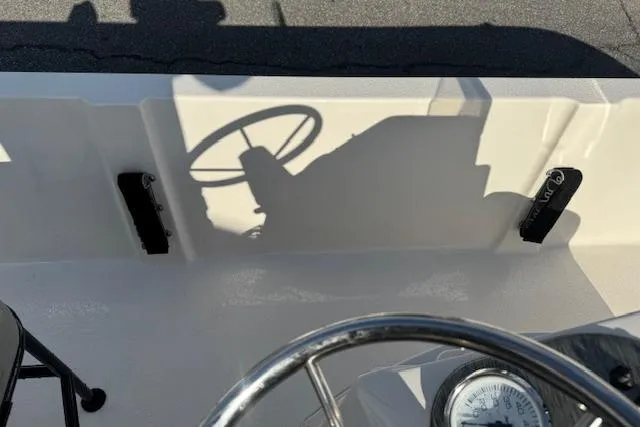 Slide: The Image of Shadow of steering wheel on Carolina Skiff 192 JLS boat deck, 2026 model. - 18