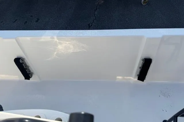 Slide: The Image of 2026 Carolina Skiff 192 JLS boat interior detail, showcasing sleek white design and hardware. - 19
