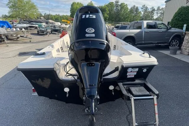 Slide: The Image of 2026 Carolina Skiff 192 JLS boat with 115 horsepower engine, parked outdoors. - 5