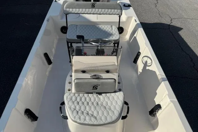 Slide: The Image of 2026 Carolina Skiff 192 JLS boat interior with seating and steering console. - 8