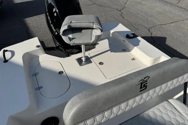 Slide: The Image of 2026 Carolina Skiff 192 JLS boat interior with seating and storage compartments. - 9