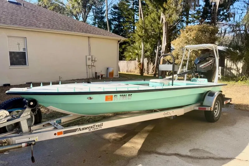 Slide: The Image of 2017 Cayo Boatworks 173 on trailer, parked outdoors near a house. - 3