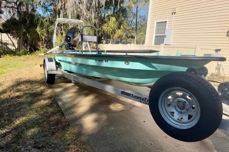 Slide: The Image of 2017 Cayo Boatworks 173 on trailer, parked outdoors near a house. - 4