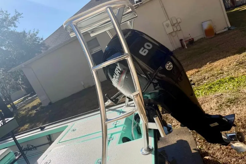 Slide: The Image of 2017 Cayo Boatworks 173 with Mercury 60 outboard motor in a residential yard. - 7