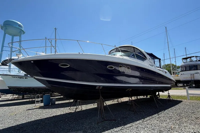 Slide: The Image of 2007 Sea Ray 380 Sundancer yacht on stands, clear sky background. - 1