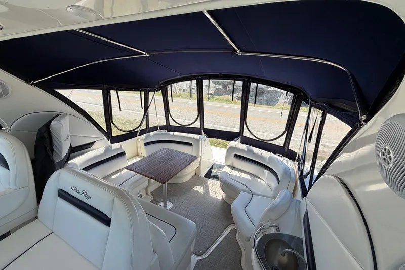 Slide: The Image of Luxurious interior of 2007 Sea Ray 380 Sundancer yacht with elegant seating and table. - 10