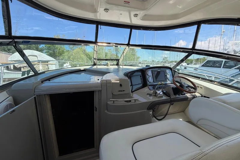 Slide: The Image of Cockpit view of 2007 Sea Ray 380 Sundancer with modern controls and panoramic windows. - 14