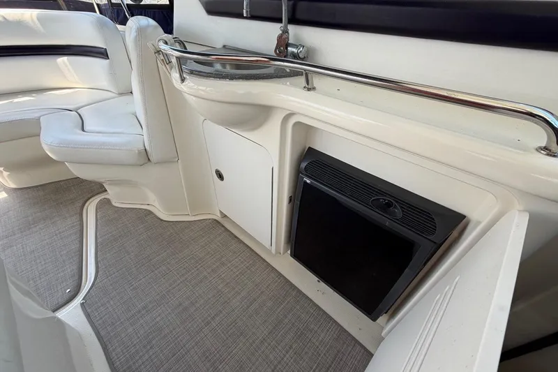 Slide: The Image of Interior of 2007 Sea Ray 380 Sundancer with seating and mini fridge. - 17