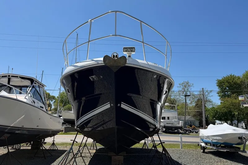 Slide: The Image of 2007 Sea Ray 380 Sundancer yacht on stands, clear sky background. - 2