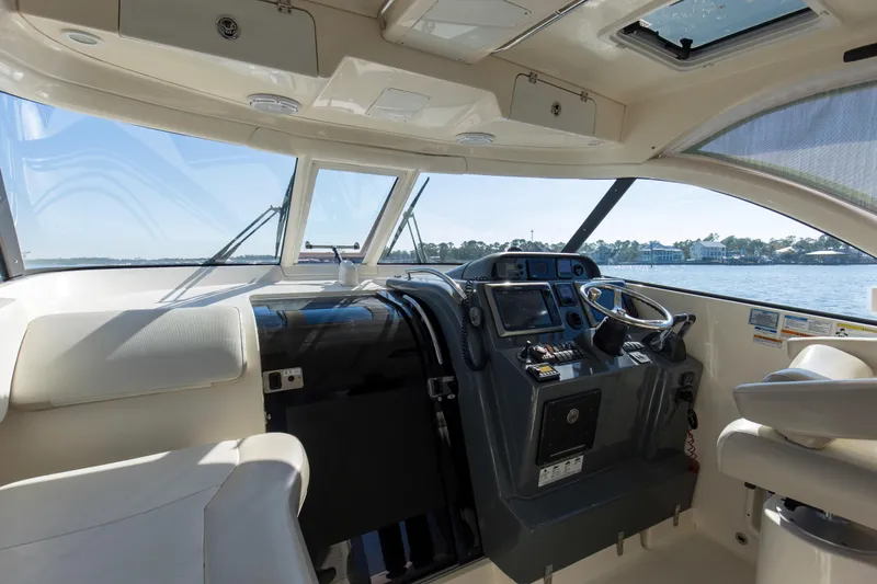 Slide: The Image of 2012 Pursuit 345 Offshore Helm, Hardtop, Windshield, Windshield Vent, Cabin Entryway - 13