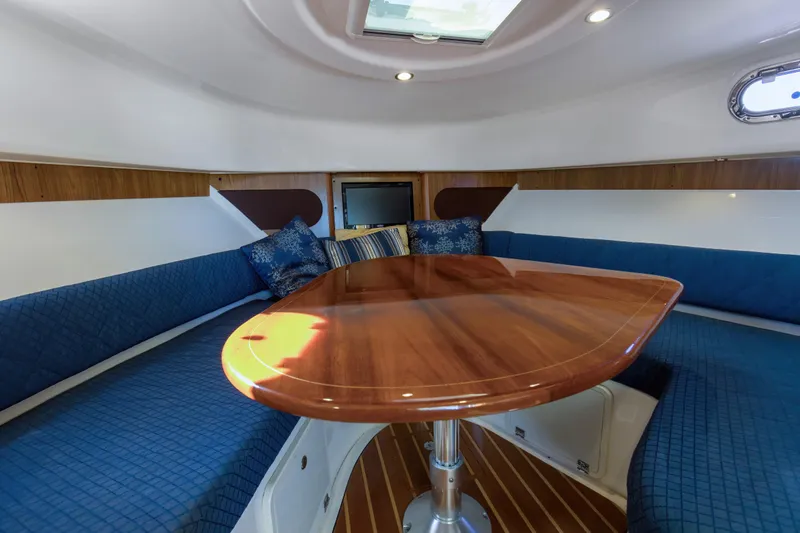 Slide: The Image of 2012 Pursuit 345 Offshore Convertible V-berth-Electrically Actuated Tabletop lowers to form base - 21