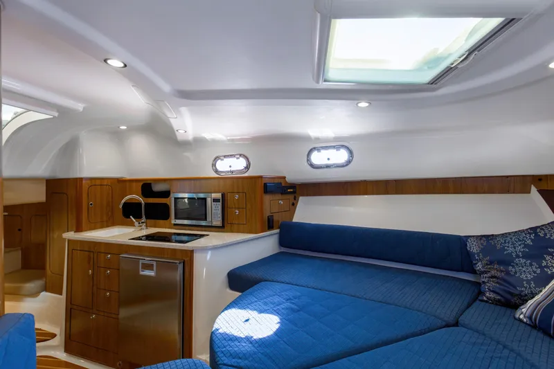 Slide: The Image of 2012 Pursuit 345 Offshore Galley/Overhead Hatch with Oceanaire Vent Cover - 23